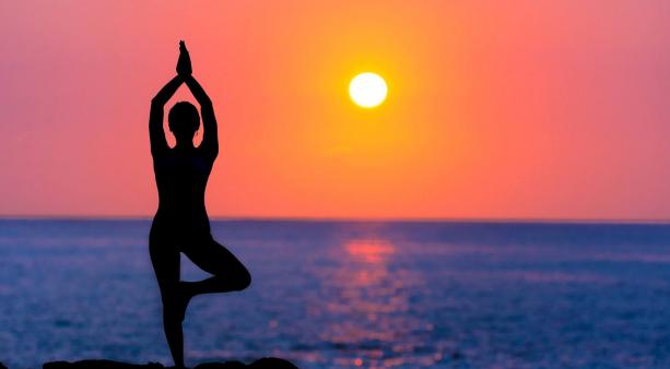 founder teaching yoga outdoors